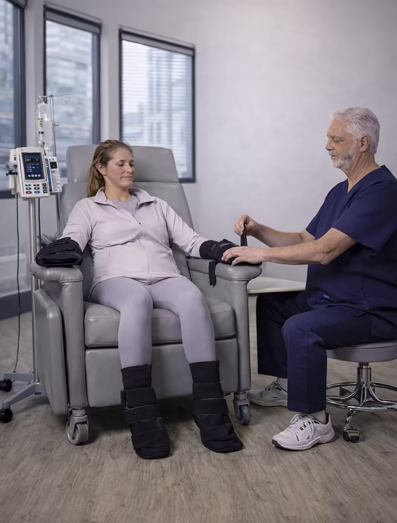 Nurse Applying SMI Chemo Infusion Cooling Wraps to a Patient Undergoing Chemotherapy