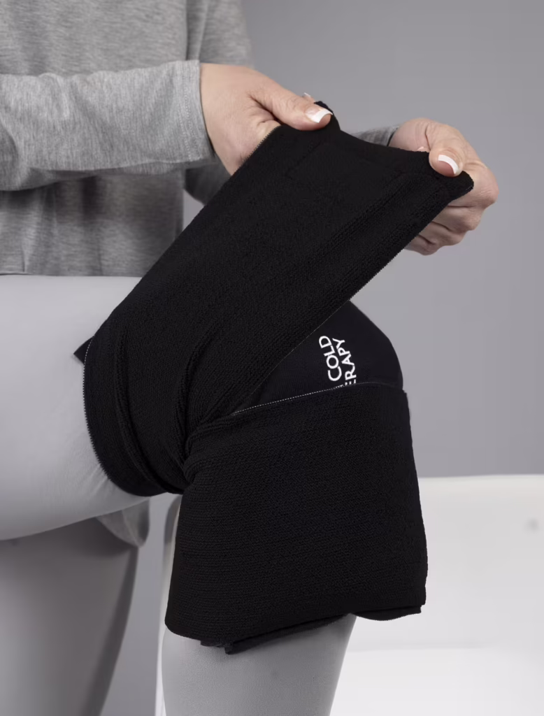 Woman Applying an SMI Cold Therapy Knee Wrap