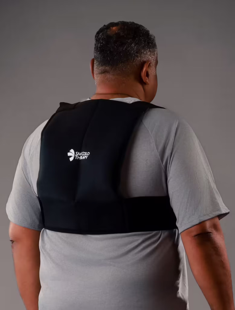 Backview of a man wearing an SMI Cold Therapy Thoracic Wrap