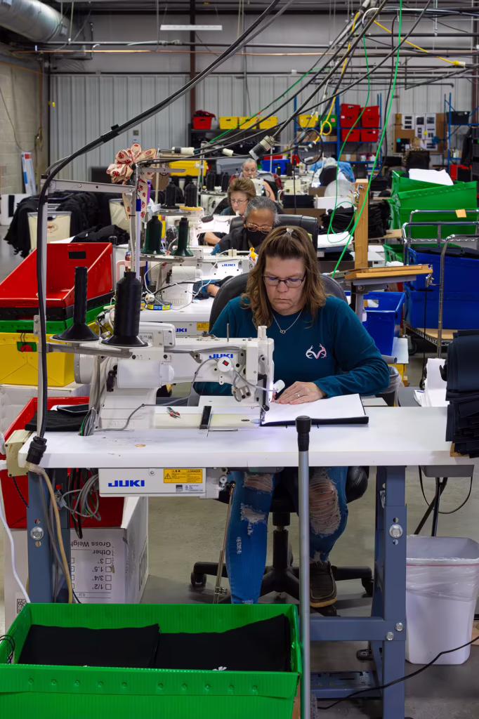 Women sewing wraps in the SMI Cold Therapy manufacturing facility