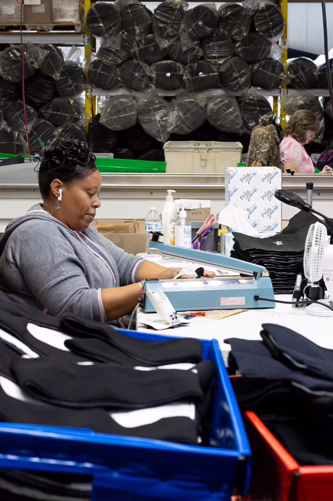 Woman working on wraps in the SMI Manufacturing Faciliyt